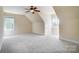 An empty bedroom featuring neutral paint, trim, carpet, and windows allowing natural light at 2607 White Pines Ct, Monroe, NC 28112