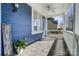 Relaxing front porch with stylish stone flooring and charming details at 2607 White Pines Ct, Monroe, NC 28112