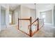 Upstairs Hallway with a view of the foyer, white walls and carpeted floor at 2607 White Pines Ct, Monroe, NC 28112