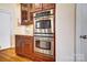 Kitchen features an island with granite countertops and stainless steel oven and microwave at 2607 White Pines Ct, Monroe, NC 28112