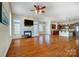 Spacious living room with hardwood floors, a fireplace, and plenty of natural light at 2607 White Pines Ct, Monroe, NC 28112