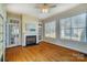 Inviting living room with fireplace, windows and doors providing lots of natural light at 2607 White Pines Ct, Monroe, NC 28112