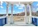 Covered porch with white columns and railings, offering a charming outdoor living space at 2607 White Pines Ct, Monroe, NC 28112