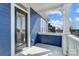 Side porch features blue siding, white railings and column with view of the outdoors at 2607 White Pines Ct, Monroe, NC 28112