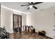 Bedroom with ceiling fan, window with curtains, and wood-look flooring at 3028 Locust Hill Rd, York, SC 29745