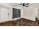 Living room with dark laminate floors and ceiling fan at 3028 Locust Hill Rd, York, SC 29745