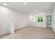 Spacious bonus room with soft carpet and plenty of natural light at 3059 Finchborough Ct # 217, Charlotte, NC 28269