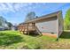 Side yard with an elevated deck offering privacy and a clear view of the surrounding landscape at 3321 15Th Sw Ave, Hickory, NC 28602