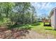 Backyard featuring lush greenery, a deck, and plenty of shade from mature trees at 3321 15Th Sw Ave, Hickory, NC 28602