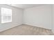Bright bedroom with neutral walls and carpet at 3321 15Th Sw Ave, Hickory, NC 28602