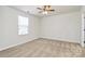 Spacious bedroom with neutral carpeting and ceiling fan at 3321 15Th Sw Ave, Hickory, NC 28602
