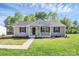 Charming single story home featuring gray siding, black shutters, and a well-manicured lawn at 3321 15Th Sw Ave, Hickory, NC 28602