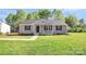 Cozy single-story home featuring gray siding, black shutters, and a perfectly green front lawn at 3321 15Th Sw Ave, Hickory, NC 28602