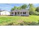 Attractive single-story home showcasing gray siding, black shutters, and a lush green lawn at 3321 15Th Sw Ave, Hickory, NC 28602