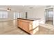 Kitchen island with granite countertop and light wood cabinets at 3321 15Th Sw Ave, Hickory, NC 28602