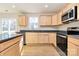 Modern kitchen with stainless steel appliances and light wood cabinets at 3321 15Th Sw Ave, Hickory, NC 28602