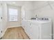 Laundry room with washer, dryer, and shelving at 3321 15Th Sw Ave, Hickory, NC 28602
