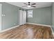 Spacious bedroom with light walls, wood flooring, and barn doors at 4224 Walker Rd, Rock Hill, SC 29730