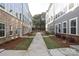 Shared courtyard with landscaping and walkways between townhomes at 5004 Rill Ct # 37, Charlotte, NC 28262