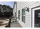 Private deck with metal railing and view of trees at 5004 Rill Ct # 37, Charlotte, NC 28262