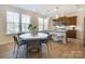 Kitchen features a round dining table with seating for six at 5004 Rill Ct # 37, Charlotte, NC 28262