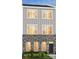 Two-story townhome with gray siding and brick accents at 5004 Rill Ct # 37, Charlotte, NC 28262