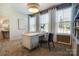 Bright home office features built-in shelving and large windows at 5004 Rill Ct # 37, Charlotte, NC 28262