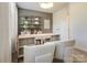 Bright home office with built-in shelving and two chairs at 5004 Rill Ct # 37, Charlotte, NC 28262