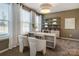 Bright home office with built-in shelving and two chairs at 5004 Rill Ct # 37, Charlotte, NC 28262