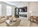 Spacious living room featuring a modern fireplace and comfortable seating at 5004 Rill Ct # 37, Charlotte, NC 28262