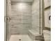 Walk-in shower with tiled walls and built-in seat at 5004 Rill Ct # 37, Charlotte, NC 28262