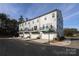 Rear view of townhomes showing garages and balconies at 5004 Rill Ct # 37, Charlotte, NC 28262
