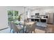 Bright dining area with glass table and access to backyard at 5067 Beargrass Dr, Dallas, NC 28034