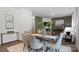 Elegant dining room with glass table and modern chairs at 5067 Beargrass Dr, Dallas, NC 28034