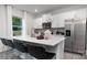 Modern kitchen with island, stainless steel appliances, and breakfast bar at 5067 Beargrass Dr, Dallas, NC 28034