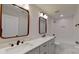 Bathroom boasts double vanity, modern fixtures, and bathtub at 5528 Brickstone Dr, Charlotte, NC 28227