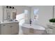 Elegant bathroom featuring a freestanding tub and double vanity at 5528 Brickstone Dr, Charlotte, NC 28227