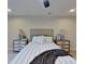 Primary bedroom with striped bedding and wooden nightstands at 5528 Brickstone Dr, Charlotte, NC 28227