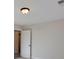 Simple bedroom with door to hallway and neutral walls at 5528 Brickstone Dr, Charlotte, NC 28227