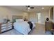 Bedroom with ceiling fan, dresser, and ensuite bathroom at 5528 Brickstone Dr, Charlotte, NC 28227