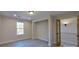 Bright bedroom with window, closet, and wood-look flooring at 5528 Brickstone Dr, Charlotte, NC 28227