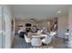 Bright dining area with wood table and white chairs, adjacent to living room at 5528 Brickstone Dr, Charlotte, NC 28227