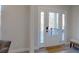 Bright entryway with a white door and a small bench at 5528 Brickstone Dr, Charlotte, NC 28227