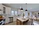 Modern kitchen with white cabinets, stainless steel appliances, and access to deck at 5528 Brickstone Dr, Charlotte, NC 28227