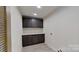 Laundry room with dark cabinets and quartz countertop at 5528 Brickstone Dr, Charlotte, NC 28227