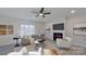 Spacious living room featuring fireplace and large windows at 5528 Brickstone Dr, Charlotte, NC 28227