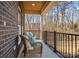 Relaxing porch with wicker chairs overlooking the backyard at 5528 Brickstone Dr, Charlotte, NC 28227