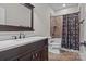 Modern bathroom with vanity, shower, and toilet at 574 Barber Loop, Mooresville, NC 28117