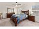 Bedroom with wood frame bed, dresser, and ceiling fan at 651 Ravina Ct, York, SC 29745