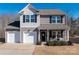 Two-story house with gray siding, white trim, and a two-car garage at 651 Ravina Ct, York, SC 29745